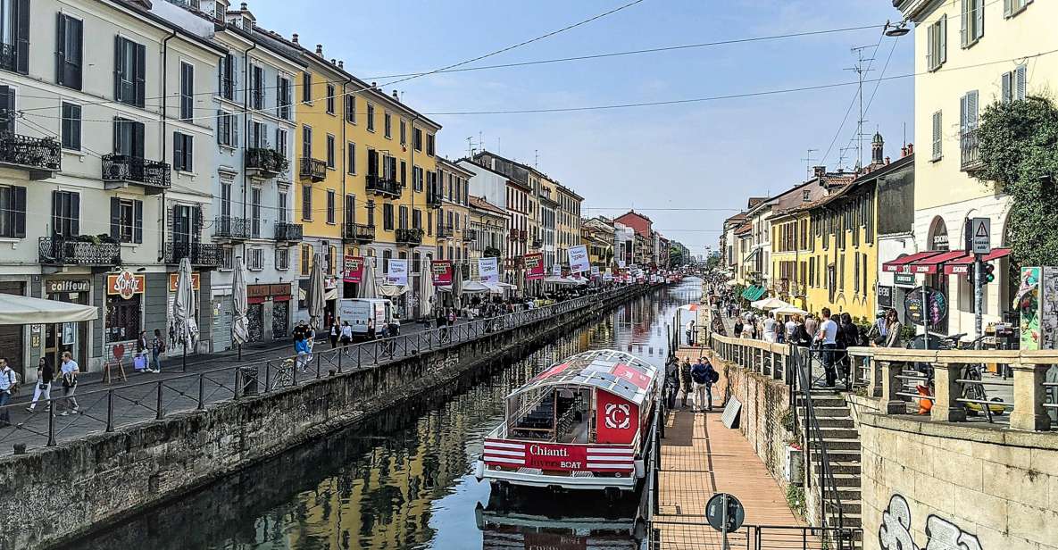 Milan: Navigli District Canal Boat Tour with Aperitivo - Cruising Naviglio Grande: Old Milan Railings, Slow Upstream Motion, and River Views