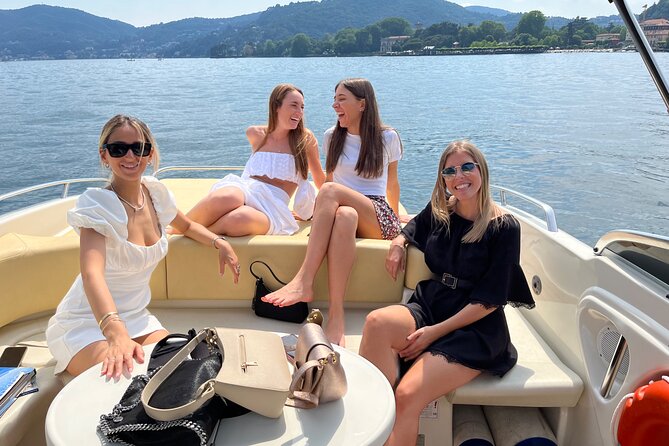 Private Boat Tour on Lake Como in Lombardy - On board comfort: stern solarium time, music choices, and prosecco