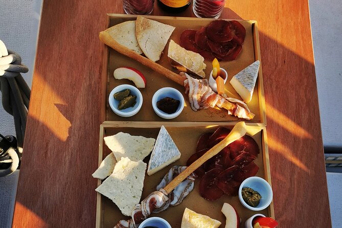 Private Tour on a Sailing Boat on Lake Maggiore with Aperitif and Music - Aperitif on board: Km 0 bites, prosecco, and accordion music