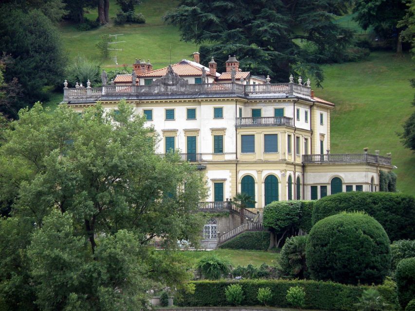 Stresa: Private Cruise to Santa Caterina del Sasso - Sailing toward Santa Caterina del Sasso: the moment the rock hermitage grabs attention